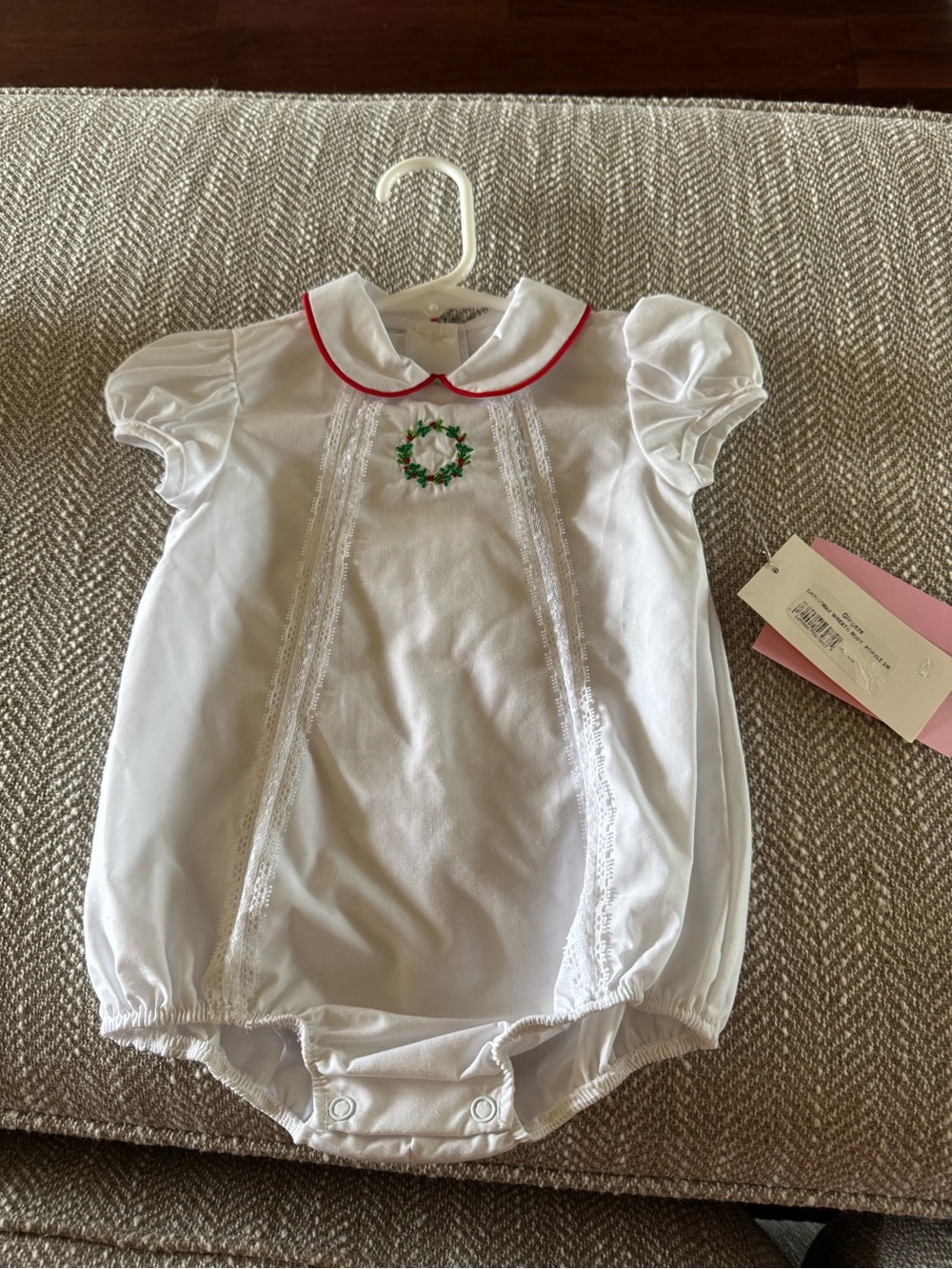 White Baby One-Piece with Red Trim and Green Wreath Embroidery